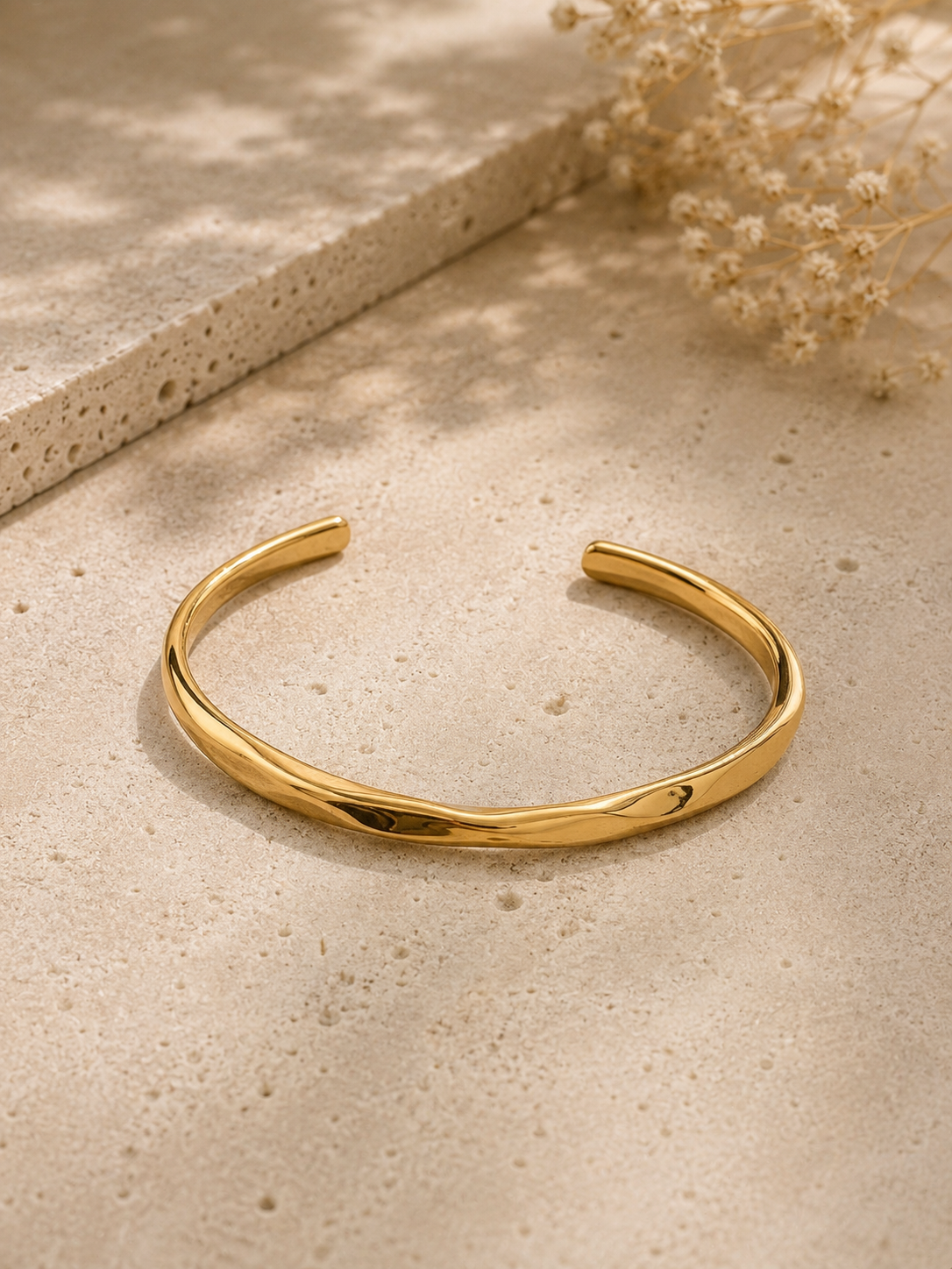 Golvende armband goud